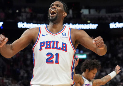 Joel Embiid, in jersey No.21, celebrates a moment during a game. The 76ers lock up Embiid to three years and USD192.9 million extension.