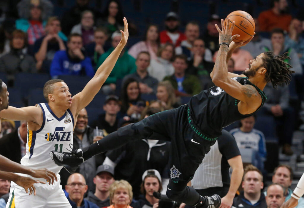 Derrick Rose, with ball, shoots over a Utah Jazz defender. Rose erupted for a career high 50 points for Minnesota on October 31, 2018