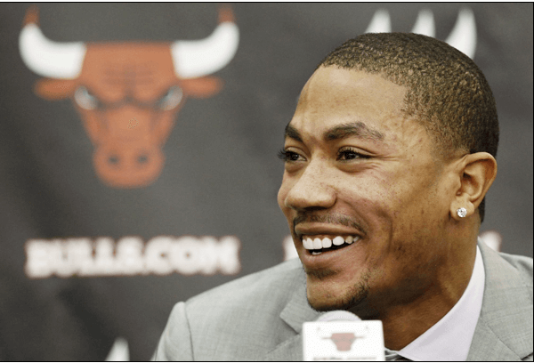 Derrick rose, in suit, signs five year extension with the Bulls worth USD94.8 million