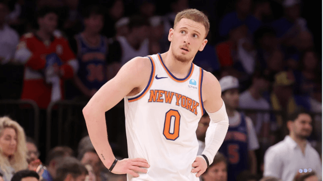 Donte Divincenzo, in New York's No.0 jersey, looks on during a game break. DiVincenzo was included in the Karl Anthony Towns trade to Ne York