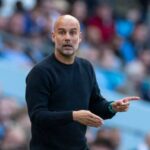 Man City manager Pep Guardioia, in black shirt, gestures during a match break., Guardiola looks forward to City's independent hearing that began on Monday.