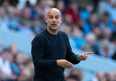 Man City manager Pep Guardioia, in black shirt, gestures during a match break., Guardiola looks forward to City's independent hearing that began on Monday.