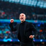 City manager Pep Guadiola, in black jacket, pumps his fist in celebration during a match. Guardiola praised City as a "fantastic team" after a draw against Inter.