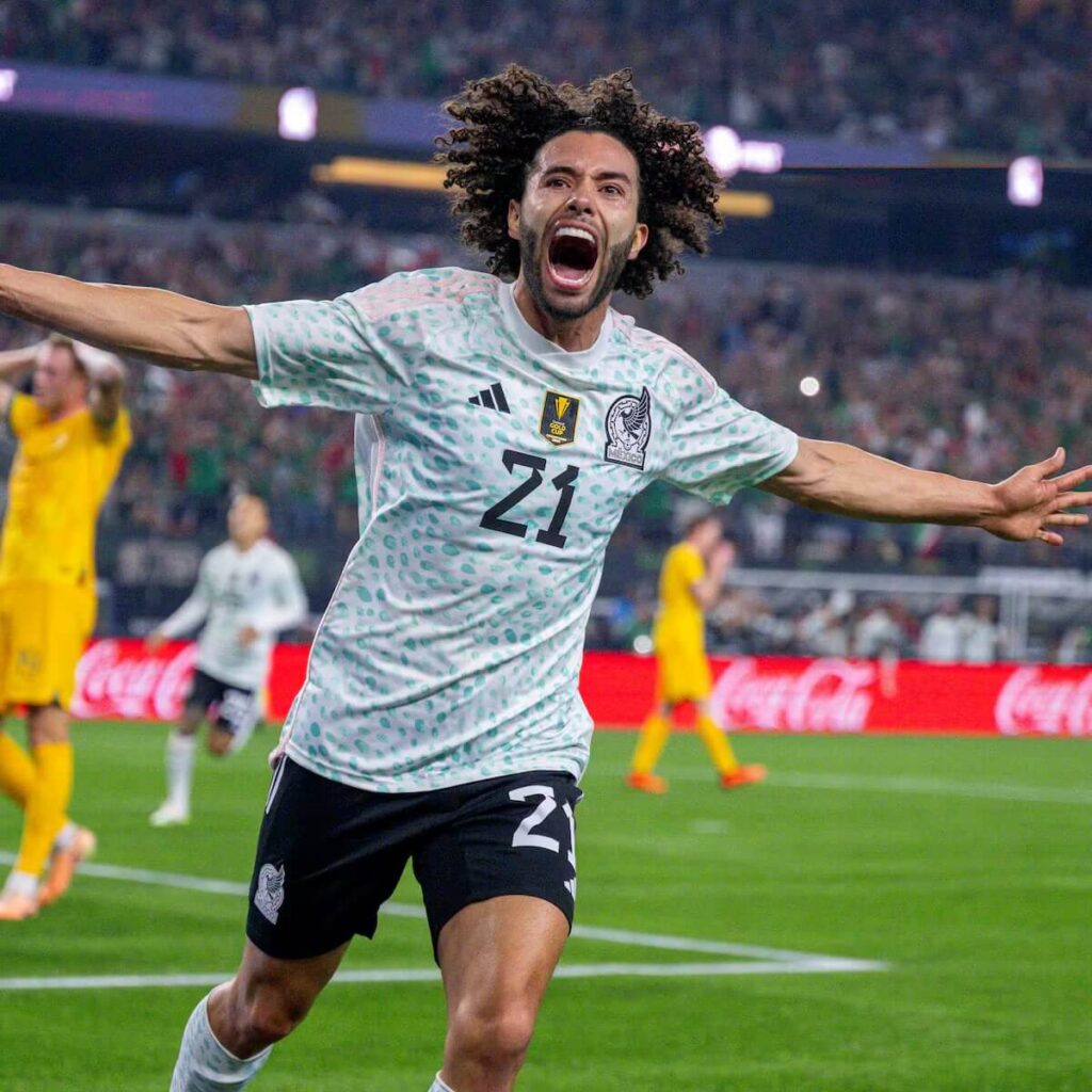 Cesar Huerta, wearoing jersey No.21, celebrates with the crowd during a match, Huerta shared a failed move to Liverpool from Pumas.