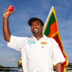 Muttiah Muralitharan, in white uniform, waves to the crowd after a match. Muralitharan doubts if his Test wickets record may be broken