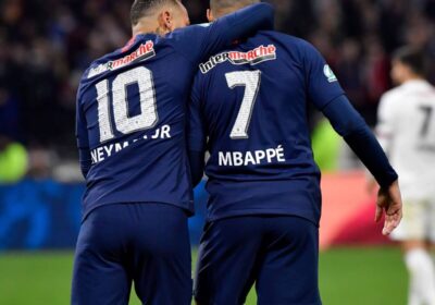 Neymar, left in jersey N0. 10, and Kylian Mbappe, right with jersey No. 7, share a light moment during a match. Neymar warns Real Madrid's Brazilian players on playing with Mbappe