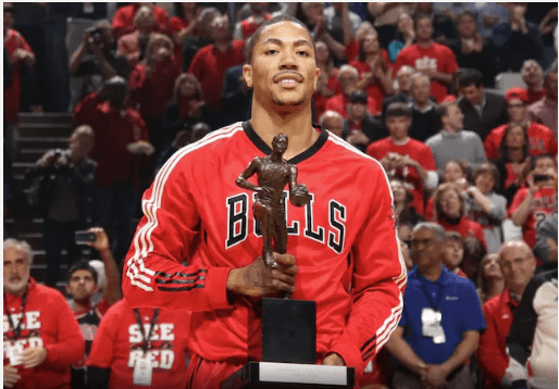 Derick Rose, holds the trophy after winning Rookie of the Year hinors after the 2008-09 season