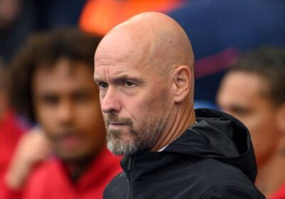 Erik Ten Hag, in black shirt, is focused in mapping out a strategy on the sidelines