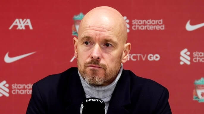 Erik Ten Hag, in black coat and gray undershirt, ponders about United's future in his post-match conference