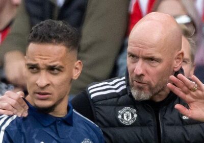 Antony, left in blue shirt, gets instructions from United manager Erik Ten Hag during a match. Ten Hag wants Antony to earn the right for his playing time at United.,