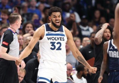 Karl Anthony Towns, in white Wolves jersey No.32, reacts during a game. The top 10 winners or losers in the Towns trade to the Knicks came up