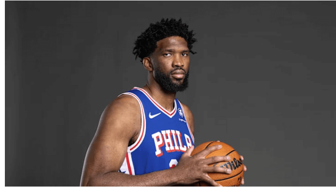 Sixers cenbter Joel Embiid poses for a photo at the team's media day availability. The NBA to review Embiid's absence in 76ers-Bucks game, preseason