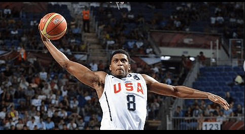 Rudy Gay, in white jersey No.8, soars for a dunk while playing for Team USA in the FIBA World Cup. Gay says 'NBA days are over,' calls it quits after 17-year career