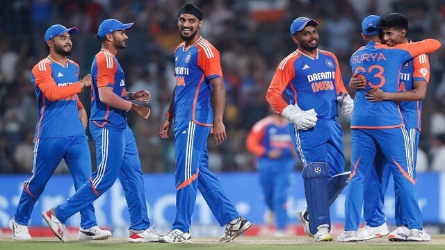 Members of the India men's cricket team huddle during a brief break during a match. India extends its T20I win run by beating Bangladesh by 7 wickets.