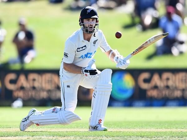 Kane Williamson, in white uniform, in action in a file photo. Williamson to skip second NZ-India Test due to injury.