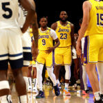 LeBron James (No.23) and Bronny James (No.9) enter the court in the second quarter of their game against the Minnesota Timberwolves. LeBron, Bronny play together in historic Lakers' NBA opener