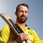 Matthew Wade, in yellow uniform, poses, in a file photo. Matthew Wade eyes coaching after international cricket retirement