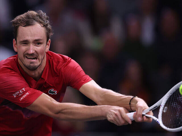 Russia's Daniil Medvedev, tries to return the ball in his match against Alexei Popyrin at the 2024 Rolex Paris Masters. Medvedev loses to Popyrin in Paris Masters