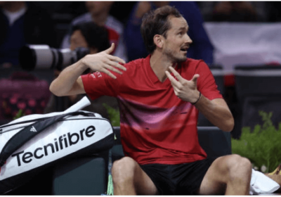 Russia's Daniil Medvedev, in red shirt, gestures to an official after his match against Alexei Popyrin on Wednesday. Medvedev loses to Popyrin in Paris Masters