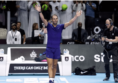 Rafael Nadal, in blue shirt and shorts, acknowledges thed cheers from the crowd in Riyadh, Saudi Arabia., Nadal says Six Kings Slam 'an opportunity to be better' despite a loss to compatriot Carlos Alcaraz.