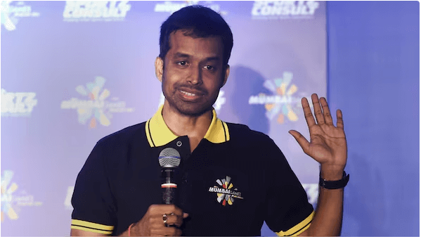 Pullela Gopichand waves to the crowd as he fields questions at a press conference. Gopichand slams badminton omission in 2026 Glasgow Games