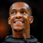 Rajon Rondo, in black hoodie, looks on in file photo. The top 10 possible Rajon Rondo traits grew after he was see at the Milwaukee Bucks' training camp on Thursday