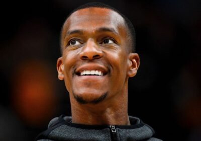 Rajon Rondo, in black hoodie, looks on in file photo. The top 10 possible Rajon Rondo traits grew after he was see at the Milwaukee Bucks' training camp on Thursday