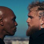 Mike Tyson, left, faces off against Jake Paul, right, at a May file photo. Tyson, Paul hype upcoming bout.