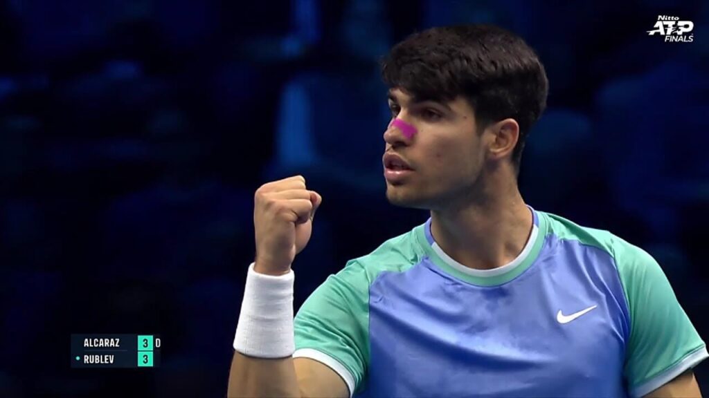 Spain's Carlos Alcaraz, in light blue/green shirt, pumps his fist, in his match against Andrey Rublev on Wednesday.  Alcaraz bounces back, beats Rublev in ATP Finals