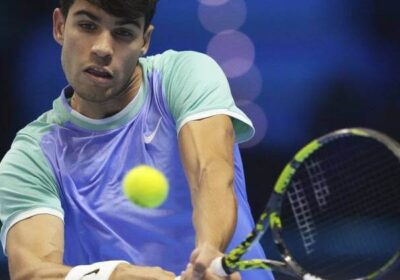 Spain's Carlos Alcaraz, in light blue/green shirt, returns a shot against Andrey Rublev in their match on Wednesday. Alcaraz bounces back, beats Rublev in ATP Finals