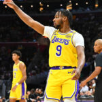 Los Angeles guard Bronny James gestures to a teammate during warmups before a game. Bronny James to G League as Lakers made it official