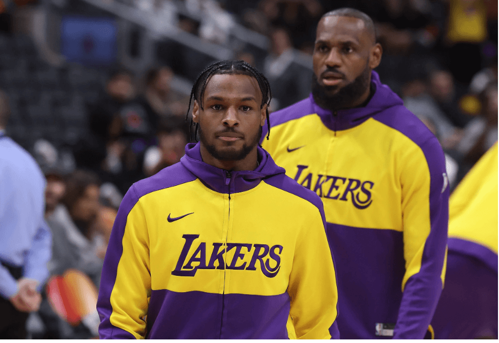 Los Angeles guard Bronny James, left, lines up ahead of his father LeBron (right) during warmups for a game. Bronny James to G League as Lakers made it official