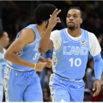 Cleveland guard Darius Garland (10) celebrates a basket in their game against the Charlotte Hornets on Sunday. Cavs top Hornets to become 4th team to start 15-0 sans Mitchell