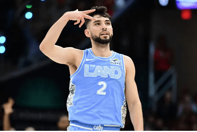 Cleveland guard Ty Jerome (2) flashes a three-pointer sign after nailing a triple in their game against the Charlotte Hornets on Sunday. Cavs top Hornets to become 4th team to start 15-0 sans Mitchell