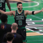 Celtics forward Jayson Tatum (center, 0), raises his arms in celebration in the Boston-Cleveland match at the TD Garden on Tuesday. Celtics hand Cavs first loss, snap Cleveland's 15-game win streak