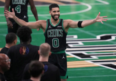 Celtics forward Jayson Tatum (center, 0), raises his arms in celebration in the Boston-Cleveland match at the TD Garden on Tuesday. Celtics hand Cavs first loss, snap Cleveland's 15-game win streak