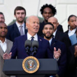 US President Joe Biden (center) speaks with members of the Boston Celtics behind him at the White House on Thursday. Celtics meet Biden in White House trip