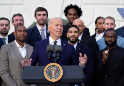 US President Joe Biden (center) speaks with members of the Boston Celtics behind him at the White House on Thursday. Celtics meet Biden in White House trip