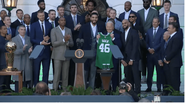 US President Joe Biden, holding Celtics No.46 jersey, beams after receiving the jersey from Boston star Jayson Tatum at the White House on Thursday. Celtics meet Biden in White House trip