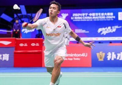 Indonesia's Jonatan Christie, in white uniform, returns a shot in Shenzhen. China Masters 2024: Christie tops Loh