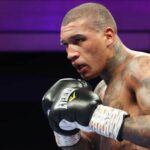 English fighter Conor Benn, in black gloves, makes a fighting pose at his last fight. Benn suspension lifted