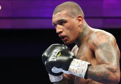 English fighter Conor Benn, in black gloves, makes a fighting pose at his last fight. Benn suspension lifted