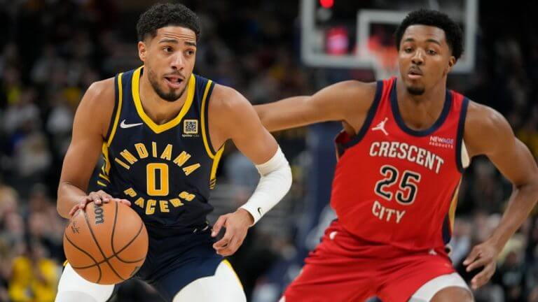 Indiana forward Tyrese Haliburton (left, 0) tries to get past New Orleans' Trey Murphy (right, 25) in their match on Tuesday. Haliburton to keep 'my joy' for basketball after his 9 treys lift Pacers