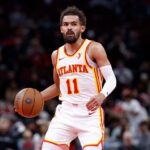 Atlanta Hawks star Trae Young (11), dribbles his way on the court in file photo. NBA fines Hawks for violating player participation policy on Young