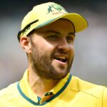 Australia's Josh Inglis, in yellow uniform, gestures during a break in a match. Inglis named as Australia's interim T20I captain against Pakistan