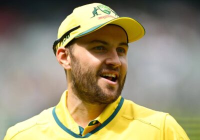 Australia's Josh Inglis, in yellow uniform, gestures during a break in a match. Inglis named as Australia's interim T20I captain against Pakistan