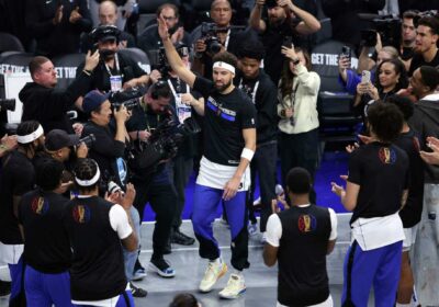 Klay Thompson, center, with hands raised, acknowledges the cheers of the crowd on Tuesday. Thompson gets 'Captain Klay' tribute in Chase Center return