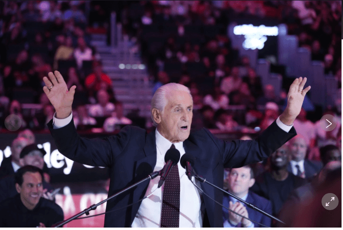 Pat Riley, raises his hands as he expresses a point in a team speech. Lakers to honor Pat Riley with statue outside arena