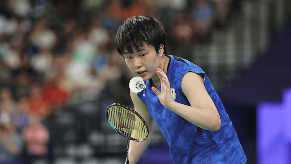 Japan's Yamaguchi Akane, in blue shirt, in action in her final match on Sunday. Li, Akane claim Kumamoto Masters Japan 2024 titles