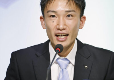 Japan's Kento Momota fields questions at a recent news conference. Momota to retire for good after S/J League season in February